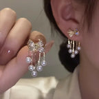 Paved Bow Pearl Tassel Earrings in Zinc Alloy