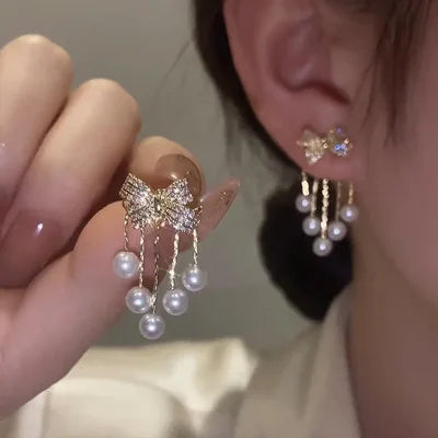 Paved Bow Pearl Tassel Earrings in Zinc Alloy